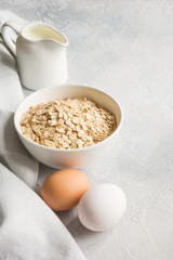 Eggs, whreat, cereals and milk for cooking useful food.