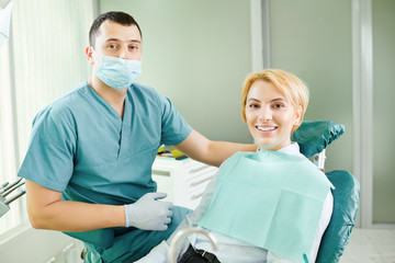 Dentist and patient are smiling