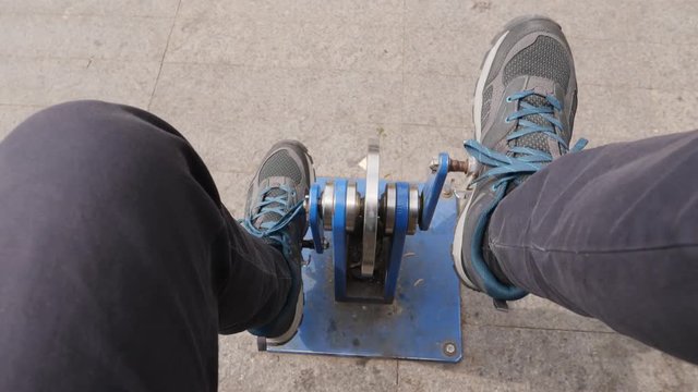 Madrid Spain man legs tries spin pedals street sports simulator workout cycling