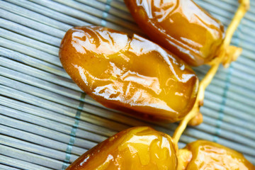 Sweet arabic algerian dates fruits on a wooden floor