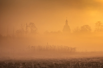 Fototapeta na wymiar Valley of the Jeziorka River on a foggy morning near Piaseczno, Masovia, Poland