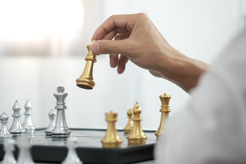 Businessman play with chess game. success management concept of business strategy and tactic challenge.