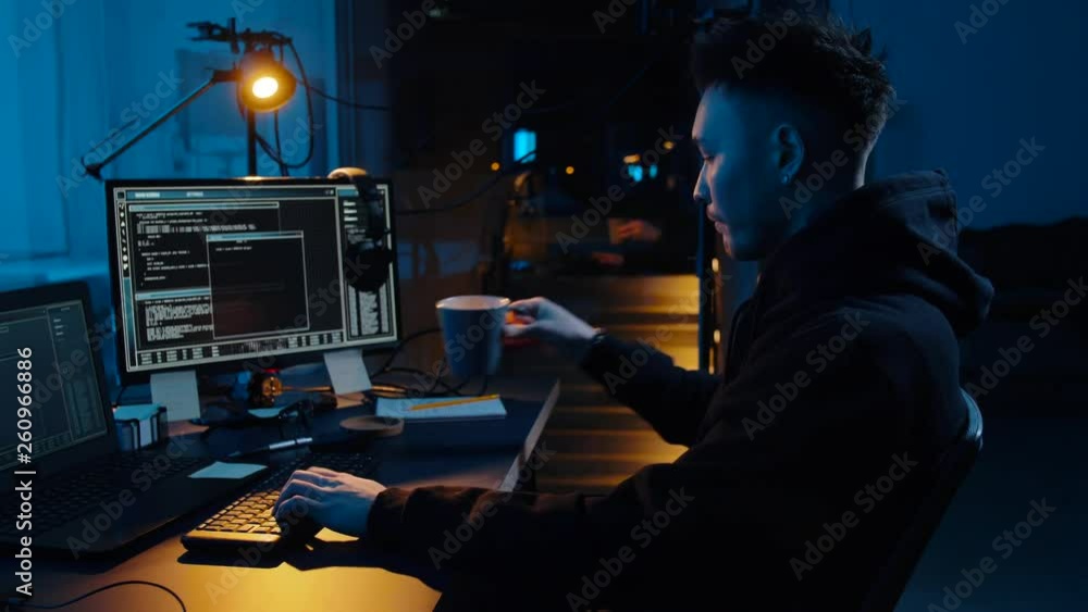 Poster cybercrime, hacking and technology concept - asian male hacker writing code or using computer virus 
