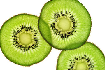 Fototapeta premium Slices of kiwi fruit on white background. Top view. Close up. High resolution product
