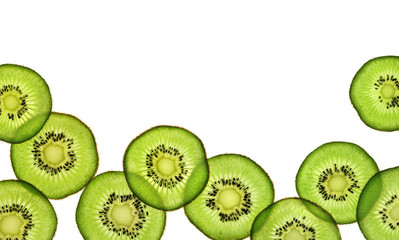 Slices of kiwi fruit on white background. Copy space for your text. Top view. High resolution...