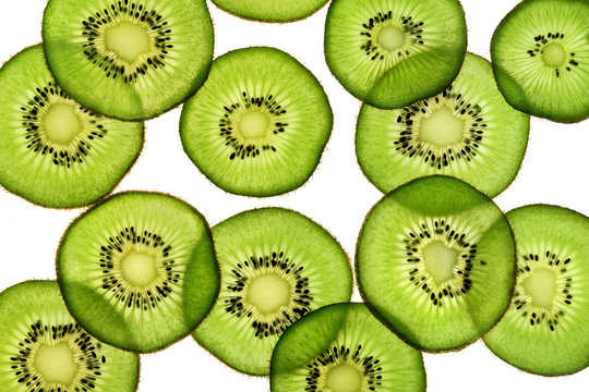 Slices of kiwi fruit on white background. Top view. Close up. High resolution product