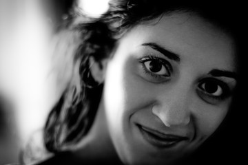 Portrait of a beautiful brunette. Enigmatic smile.