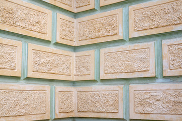 Fragment of the walls of the building in the style of Stalin's classicism. Plastered beige and...
