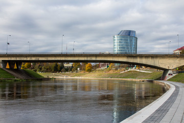 The embankment of the Narva River and the bridge across this river in Vilnius. Lithuania