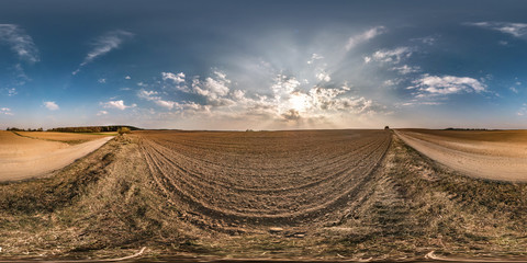 full seamless spherical panorama 360 degrees angle view near gravel road among meadow fields in...