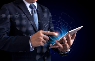 Businessman pointng tablet for analyze finance at logistics port ,transportation trading business concept, world map element