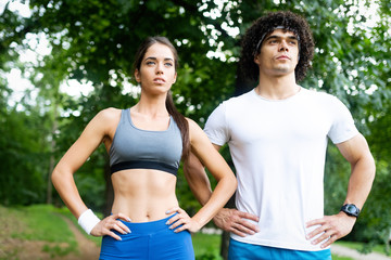 Fototapeta premium Happy young people jogging and exercising in nature
