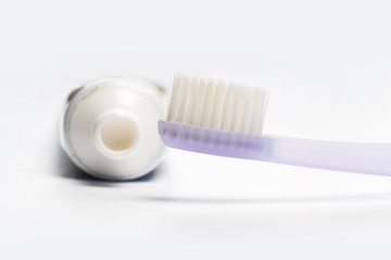 Flat lay composition with toothbrushes on white background.