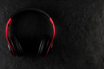 Headphones on a black stone background