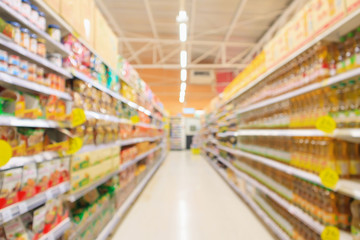 supermarket aisle with seasoning and cooking vegetable oil bottles product shelves interior...