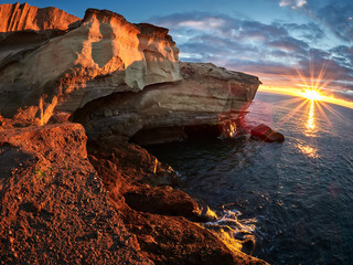Rocky coast of San Miguel del Tajao of the southeast part of Tenerife at sunrise in the Spanish Canary Islands
