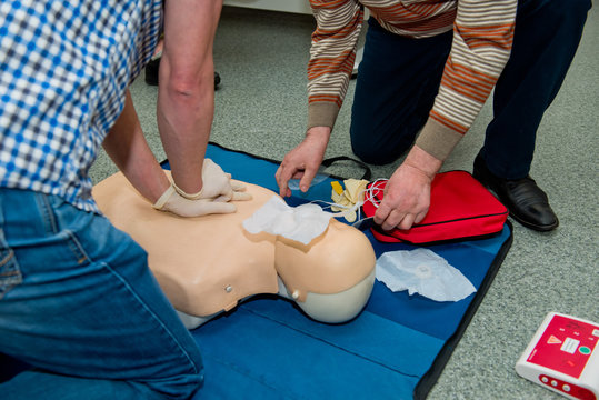 First aid cardiopulmonary resuscitation course using automated external defibrillator device, AED.