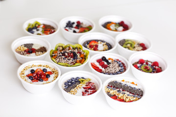 Healthy food on a white background. Smoothies with berries, fruits and nuts.