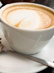 Cappuccino or Latte coffee art cup with heart shaped