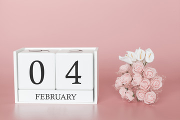 February 04th. Day 4 of month. Calendar cube on modern pink background, concept of bussines and an importent event.