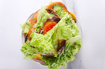 Top view of pile of sandwiches on pate, marble kitchen table.Tasty and easy vegetarian snack