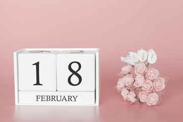 February 18th. Day 18 of month. Calendar cube on modern pink background, concept of bussines and an importent event.