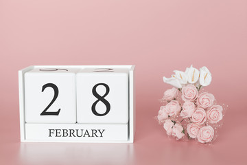 February 28th. Day 28 of month. Calendar cube on modern pink background, concept of bussines and an importent event.