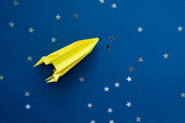 Paper homemade origami rocket. Original Space concept