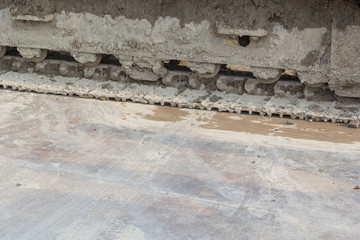 Dirty backhoe wheel and mud on wheel