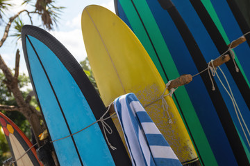 Stack of different surfboard for a rental on the beach