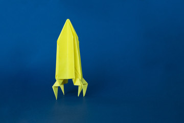 Paper homemade origami rocket. Original Space concept