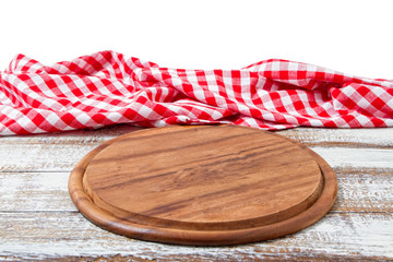 empty pizza board and tablecloth on table isolated on white background copy space
