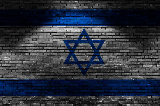 Israel Flag On Brick Wall At Night