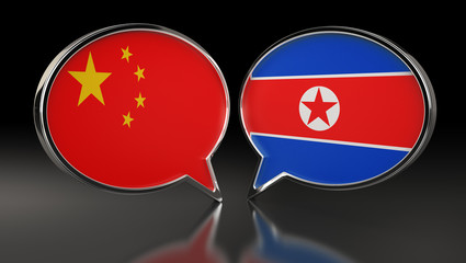 China and North Korea flags with Speech Bubbles. 3D Illustration