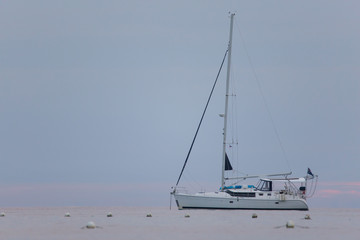 Sailing Boat Sailboat anchoring infront the white beach a Tranquil seascape scene with calm sea