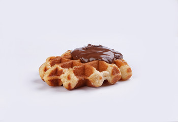 waffle with chocolate nut cream on a white background