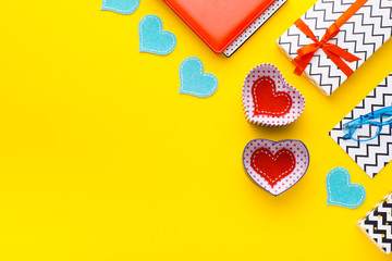 Person holding a present for Saint Valentine's day in his hands. Beautiful colorful background to st. Valentine day. Greeting card with red hearts. Wedding's invitation. Love expression. 