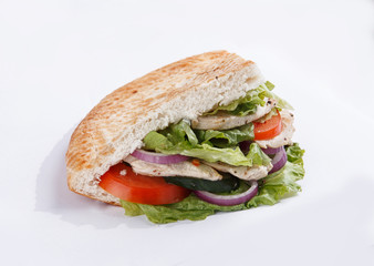 chicken sandwich with vegetables on a white background