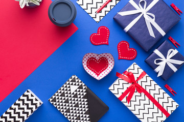 Obraz premium Person holding a present for Saint Valentine's day in his hands. Beautiful colorful background to st. Valentine day. Greeting card with red hearts. Wedding's invitation. Love expression. 