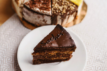 Assortment of pieces of cake on messy table, copy space. Several slices of delicious desserts, restaurant menu concept, top view