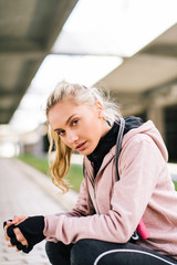 Girl in active wear. Athlete wears a hood.