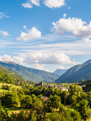 Fototapeta premium Broto, church with the mountains at bottom, Pyrenees
