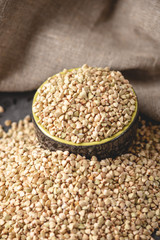 Green buckwheat on a dark background. Vegan nutritious and healthy product. Concept of organic food