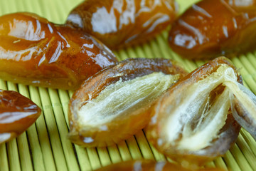 sweet algerian arabic split dates fruits open on a wooden ground