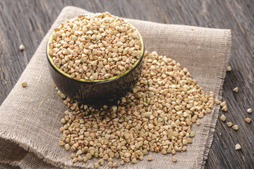 Green buckwheat on a dark background. Vegan nutritious and healthy product. Concept of organic food