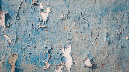 Old wall with dried, damaged very old paint. Texture, background.