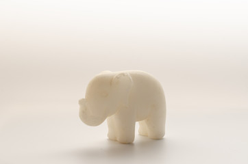 Fototapeta na wymiar Old Toy Elephant of marble on a white background.