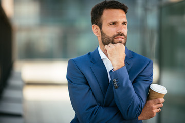 Businessman on a coffee break. Manager otuside drinking coffee. Lawyer having a break , drinks coffee to go.