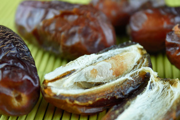 sweet algerian arabic split dates fruits open on a wooden ground