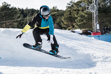 Snowboarder falling after the jump